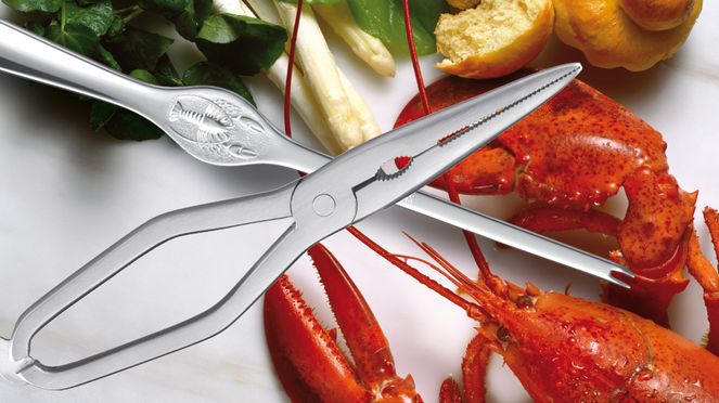 
                    Set à homard triangle avec une pince à homard et 6 fourchettes à homard
